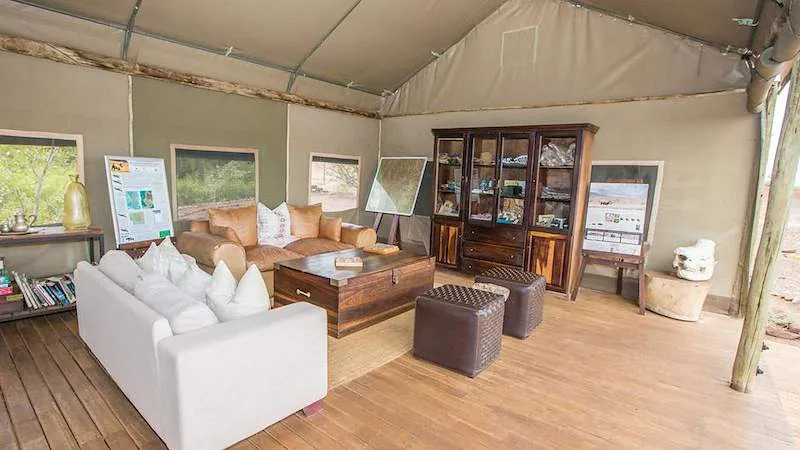 A comfortable guest lounge inside Desert Rhino Lodge.
