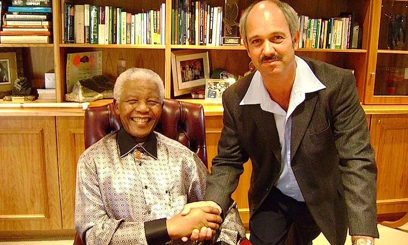 Christo Brand, a former Robben Island prison guard, pictured with a visitor.