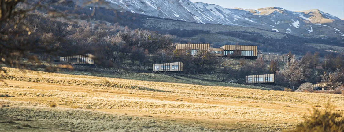 Awasi Patagonia's cabins sit at the foot of snow-dusted mountains.