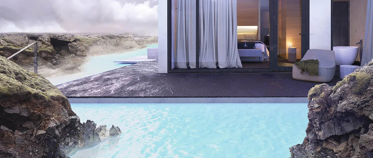 A Retreat Hotel suite opening toward turquoise geothermal water and dark lava rock.