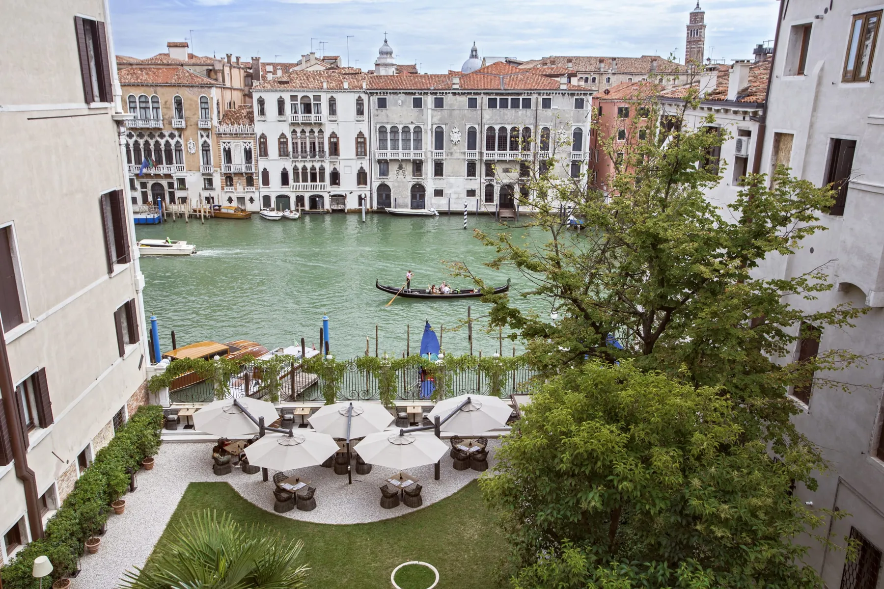 A private hotel garden terrace overlooking the Grand Canal in Venice.