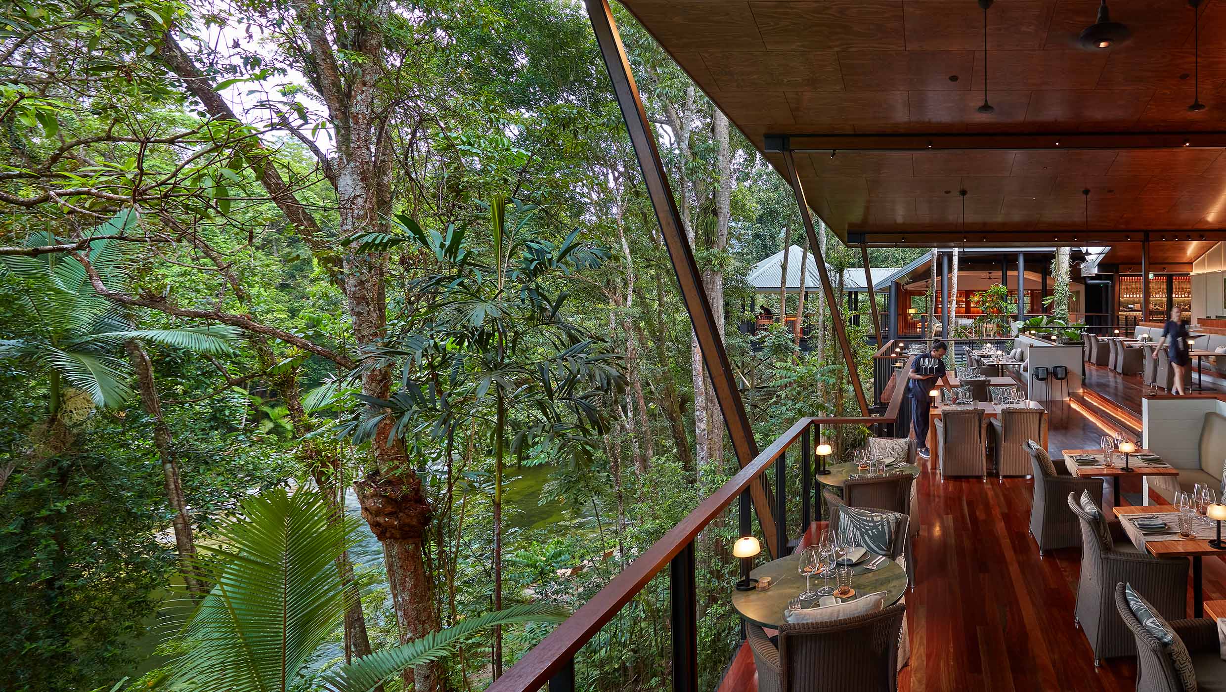 A dining pavilion at Silky Oaks Lodge opens onto dense Daintree rainforest.